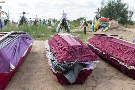 BUCHA, UKRAINE - Sep. 02, 2022: Burial of the remains of 13 unidentified and two identified people who were killed in the Bucha district during the Russian occupationのeditorial素材