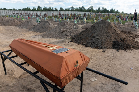 BUCHA, UKRAINE - Sep. 02, 2022: Burial of the remains of 13 unidentified and two identified people who were killed in the Bucha district during the Russian occupationのeditorial素材