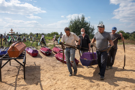BUCHA, UKRAINE - Sep. 02, 2022: Burial of the remains of 13 unidentified and two identified people...