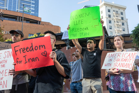 PORTLAND, OREGON, USA - Oct 15, 2022: People participate in a demonstration in solidarity with...