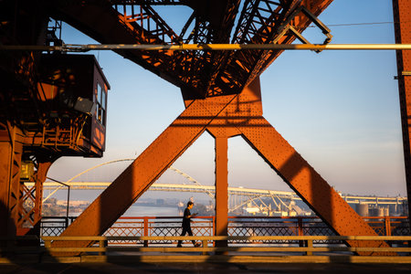 PORTLAND, OREGON, USA - Oct. 14, 2022: Farms metal vehicular and pedestrian bridge painted red. Broadway Bridge is a Rall-type bascule bridge spanning the Willamette River in Portland built in 1913のeditorial素材