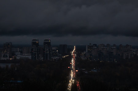 KYIV, UKRAINE - Nov 03, 2022: Blackout in the Ukrainian capital Kyiv. Capital streets without street lighting. Only the lights of passing cars are visible.のeditorial素材