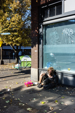 Portland, OR, USA - Oct 15, 2022: Homeless man on the street of Portland