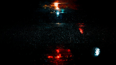 Blackout in Kyiv. Drops of rain and sleet on the streets of Kyiv illuminated by the headlights of carsの写真素材