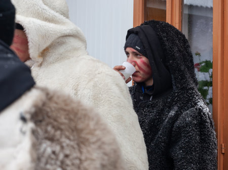 Krasnoilsk, Ukraine - January 14, 2018: Malanka or Generous Evening is a Ukrainian national and church holiday. Ancient pagan ritual of Malanka. People in festive carnival and national costumes.のeditorial素材