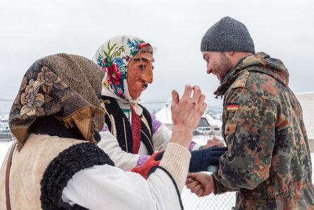 Krasnoilsk, Ukraine - January 14, 2018: Malanka or Generous Evening is a Ukrainian national and church holiday. Ancient pagan ritual of Malanka. People in festive carnival and national costumes.のeditorial素材