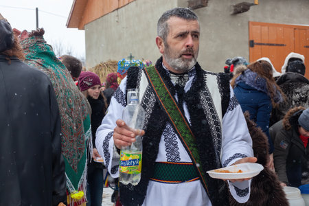 Krasnoilsk, Ukraine - January 14, 2018: Malanka or Generous Evening is a Ukrainian national and church holiday. Ancient pagan ritual of Malanka. People in festive carnival and national costumes.のeditorial素材
