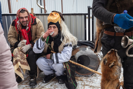 Krasnoilsk, Ukraine - January 14, 2018: Malanka or Generous Evening is a Ukrainian national and church holiday. Ancient pagan ritual of Malanka. People in festive carnival and national costumes.のeditorial素材
