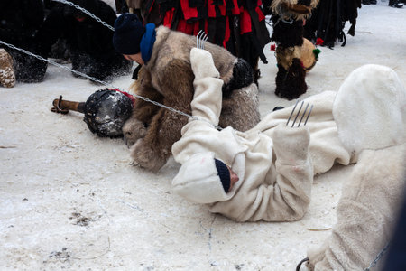 Krasnoilsk, Ukraine - January 14, 2018: Malanka or Generous Evening is a Ukrainian national and church holiday. Ancient pagan ritual of Malanka. People in festive carnival and national costumes.のeditorial素材
