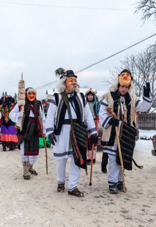 Krasnoilsk, Ukraine - January 14, 2018: Malanka or Generous Evening is a Ukrainian national and church holiday. Ancient pagan ritual of Malanka. People in festive carnival and national costumes.のeditorial素材