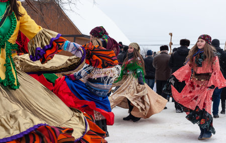 Krasnoilsk, Ukraine - January 14, 2018: Malanka or Generous Evening is a Ukrainian national and church holiday. Ancient pagan ritual of Malanka. People in festive carnival and national costumes.のeditorial素材