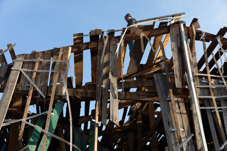 KYIV, UKRAINE - Jan. 03, 2023: War in Ukraine. Volunteers clear and dismantle debris at the site of a Russian missile attack on December 31のeditorial素材