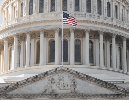American flag on the background of the Capitol in Washington DCの写真素材