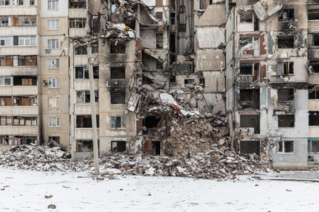 KHARKIV, UKRAINE - Mar. 02, 2023: The scars of war in Ukraine. Destroyed apartment building. Aftermath of a rocket attack, capturing the devastating impact of war in North Saltivka, Kharkiv.のeditorial素材