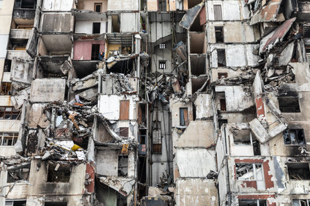 KHARKIV, UKRAINE - Mar. 02, 2023: The scars of war in Ukraine. Destroyed apartment building. Aftermath of a rocket attack, capturing the devastating impact of war in North Saltivka, Kharkiv.のeditorial素材
