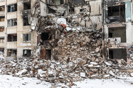 KHARKIV, UKRAINE - Mar. 02, 2023: The scars of war in Ukraine. Destroyed apartment building. Aftermath of a rocket attack, capturing the devastating impact of war in North Saltivka, Kharkiv.のeditorial素材