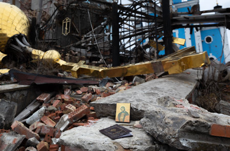 An icon can be seen on the ruins of the church. The tragic aftermath of violence and aggression, as a church stands in ruins from the horrors of war in Bogorodichne Donetsk reg.の写真素材