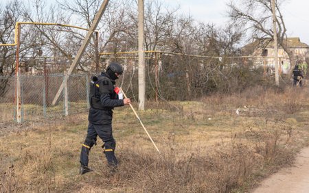 KHERSON, UKRAINE - Mar. 08, 2023: A team of mine clearance operator is seen working to clear mines...