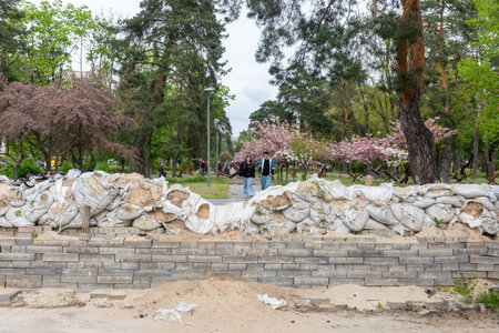 KYIV, UKRAINE - May. 04, 2023: Sakura trees have blossomed in Kyoto Park in Kyiv and marks of war in Kyiv park.のeditorial素材