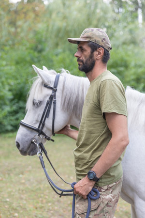 KYIV, UKRAINE - Aug. 23, 2023: Session of hippotherapy for Ukrainian soldiers who were in combat zones in Kyiv, Ukraineのeditorial素材