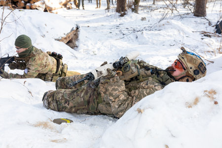KYIV, UKRAINE - Jan. 12, 2024: Ukrainian civilians take part in the final exercise of an in-depth five-day course on preparing citizens for national resistance, amid the Russian invasion of Ukraine.のeditorial素材