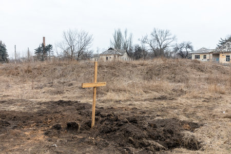 SIVERSK, DONETSK REG., UKRAINE - Mar. 10, 2024: Due to the constant shelling dead residents of Siversk are now buried right next to the hospital. There are already 20 graves here, 6 inlast two weeksのeditorial素材