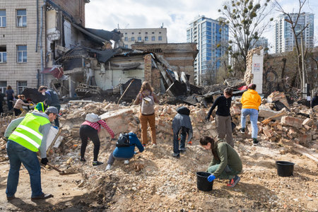 KYIV, UKRAINE - Mar. 30, 2024: Students and volunteers remove debris at Kyiv State Academy of Decorative Applied Arts and Design after it was damaged in a Russian missile strikeのeditorial素材