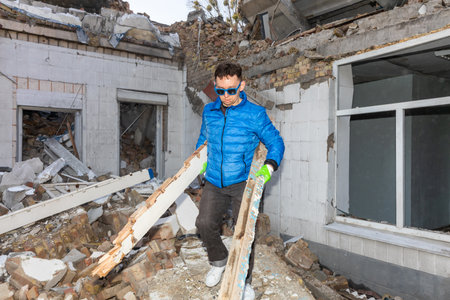 KYIV, UKRAINE - Mar. 30, 2024: Students and volunteers remove debris at Kyiv State Academy of...