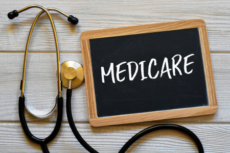 A chalkboard with the word medicare displayed next to a stethoscope, set against a wooden background.の写真素材