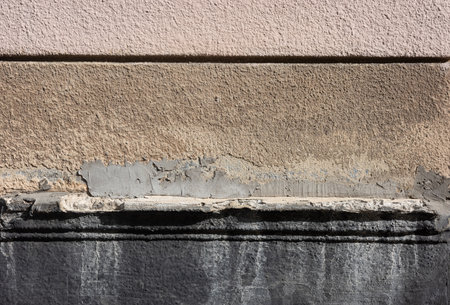 This image displays an abstract background with layers of textured wall surfaces, showcasing the...
