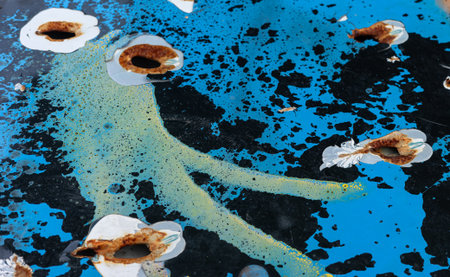 Artifacts of the war in Ukraine. Close-up of a damaged vehicle marked by gunfire, representing...