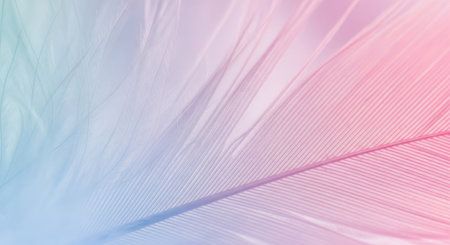 A close up view of a feather in soft hues of blue, purple, and pink, showcasing delicate textures and patterns. The lighting creates a serene and ethereal effect.の写真素材