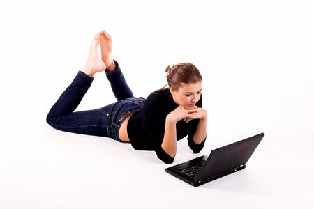 Beautiful young girl with her laptopの写真素材