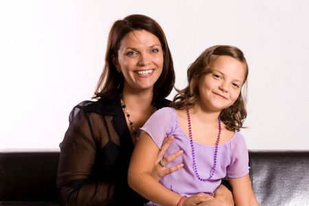 6 years old girl with her motherの写真素材