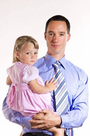 Young businessman with his 2 years old daughterの写真素材