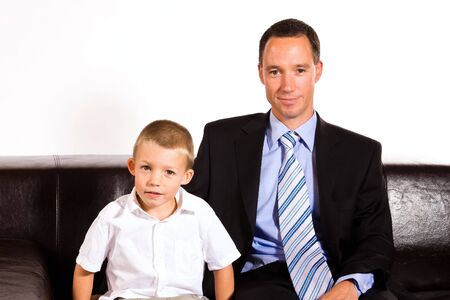 Young businessman with his 6 years old sonの写真素材