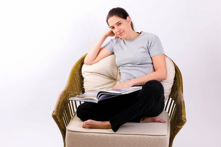 Young woman with a big bookの写真素材