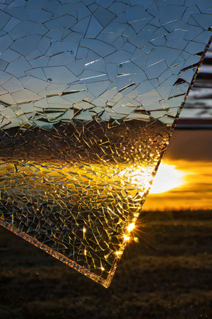 broken glass on sunset background, broken glass on the field, broken glassの写真素材