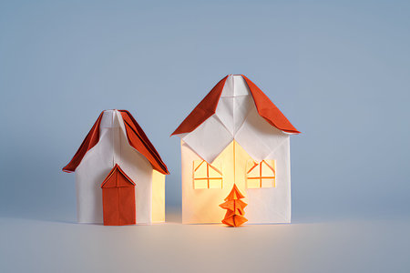 Paper origami house on blue background. 3d render illustration.の写真素材