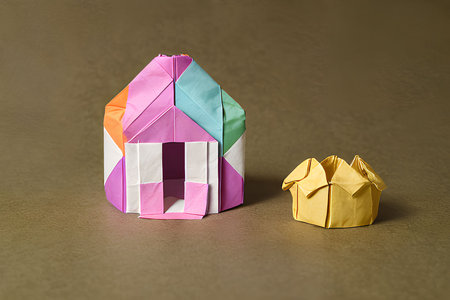 Paper origami house on brown background. Colorful origami house.の写真素材