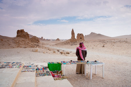 Palmyra, Syria- November 28, 2008: Bedouin selling handcrafts at the site of the  ancient city of Palmyra, Syrian Desert. Dating back to the Neolithic era, the city of Palmyra, was a strategically located oasis first attested in the early second millenniuのeditorial素材