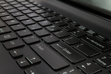 Black Laptop Computer Keyboard close-up shot at a shallow depth of fieldの写真素材