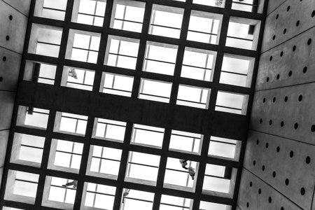 Square floor pattern, glass floor and walking people photographed in Black and White in the  Acropolis museum.のeditorial素材