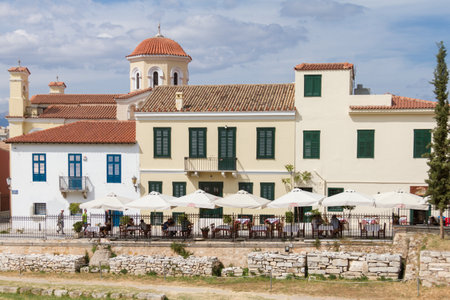 Athens, Greece - April 30, 2016: Church and traditional buildings and restaurants near Roman Forum, Athens.のeditorial素材