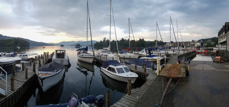 Bowness-on-Windermere, England - September 13, 2016: Panoramic view of Moored Yachts as the Sun Sets over Lake WIndermereのeditorial素材