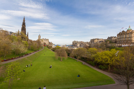 Edinburgh, Scotland - 19 April, 2017: Scenic view of  Princess Street Gardens in Edinburgh, with people enjoying themselves on a beautiful spring afternoonのeditorial素材