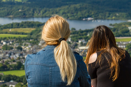 Keswick, United Kingdom - 13 August, 2017: Woman and girl gazing at Keswick and lake Derwent Water from Latrigg, Cumbria, UKのeditorial素材
