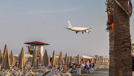 Larnaca, Cyprus - April 29, 2018: An Aegean Airlines AIrbus airplane above McKenzie beach just before landing at Larnaca International Airportのeditorial素材
