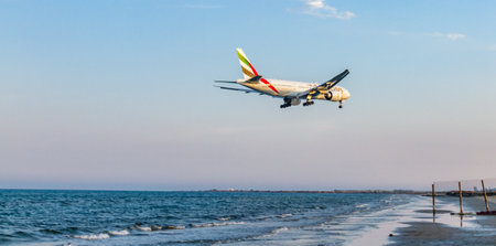 Larnaca, Cyprus - April 29, 2018: Emirates Airline Boeing 777 above the sea seconds before landing at Larnaca International Airportのeditorial素材