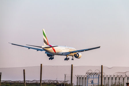 Larnaca, Cyprus - April 29, 2018: Emirates Airline Boeing 777 above the fence seconds before landing at Larnaca International Airportのeditorial素材